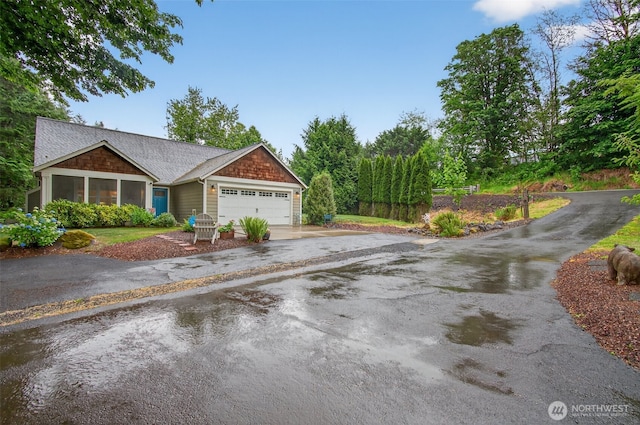 721 Abernathy Creek Rd, Longview, WA 98632 - view of front of house featuring driveway, an attached garage, and a sunroom