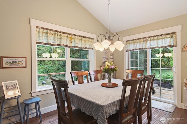 721 Abernathy Creek Rd, Longview, WA 98632 - dining room with a chandelier, plenty of natural light, dark wood-style floors, and lofted ceiling