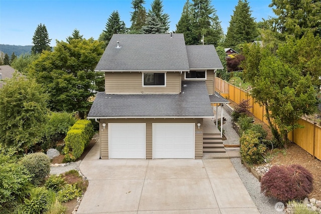 26710 NE Stephens St, Duvall, WA 98019 - view of front of home with an attached garage, a shingled roof, and driveway
