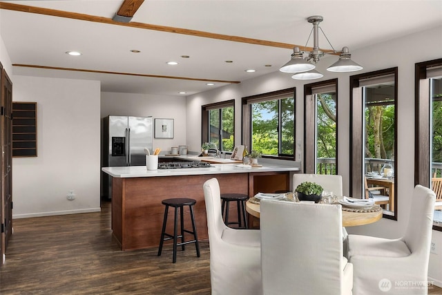 26710 NE Stephens St, Duvall, WA 98019 - kitchen with stainless steel fridge with ice dispenser, dark wood-style floors, light countertops, recessed lighting, and pendant lighting