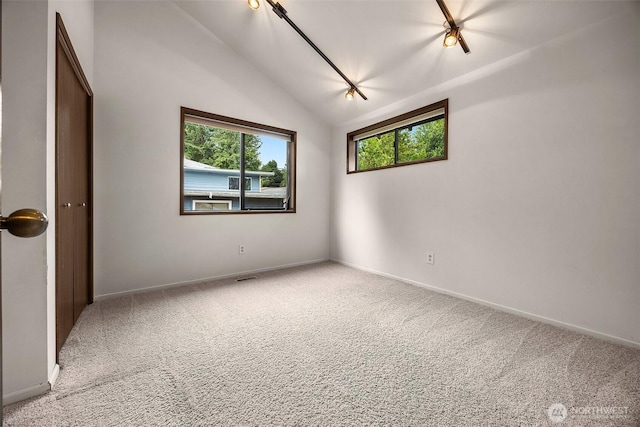 26710 NE Stephens St, Duvall, WA 98019 - carpeted spare room with baseboards and lofted ceiling