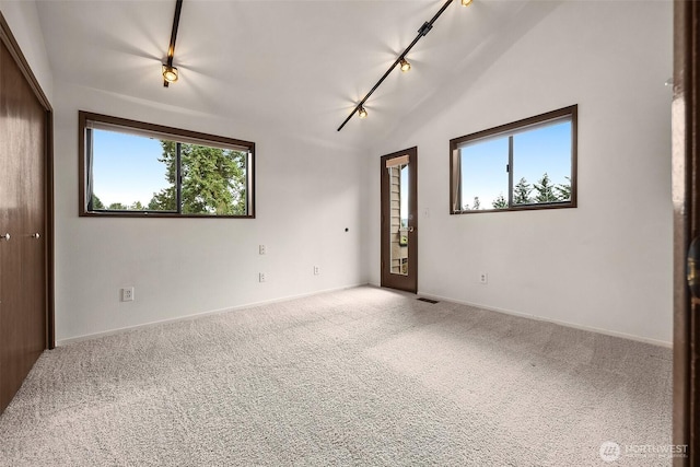 26710 NE Stephens St, Duvall, WA 98019 - carpeted empty room with healthy amount of natural light, track lighting, and vaulted ceiling