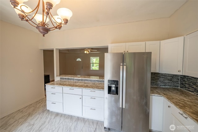 1117 W Stockwell St, Aberdeen, WA 98520 - kitchen with stainless steel refrigerator with ice dispenser, white cabinets, and light stone counters