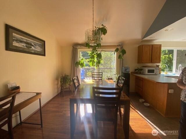5846 SW 44th St, Port Orchard, WA 98367 - dining space featuring vaulted ceiling and dark wood-style flooring