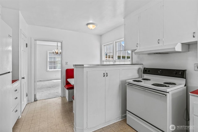 2809 Nichols Blvd, Longview, WA 98632 - kitchen featuring white appliances, under cabinet range hood, white cabinetry, and a chandelier