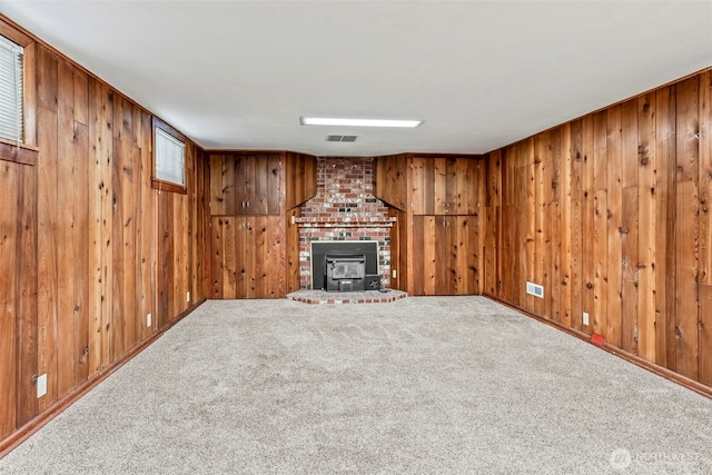 2809 Nichols Blvd, Longview, WA 98632 - unfurnished living room featuring wood walls, carpet flooring, and a fireplace