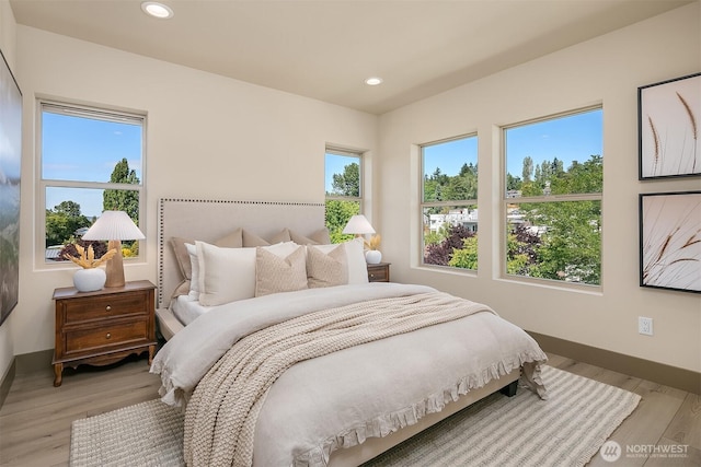 5037 25th Ave SW, Seattle, WA 98106 - bedroom with recessed lighting and light wood-type flooring