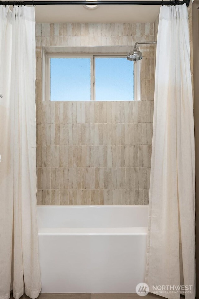 5037 25th Ave SW, Seattle, WA 98106 - full bathroom with plenty of natural light and shower / tub combo with curtain