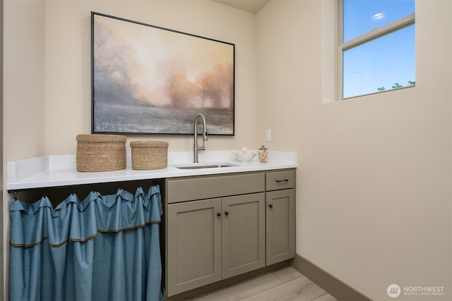 5037 25th Ave SW, Seattle, WA 98106 - bathroom featuring vanity and wood finished floors