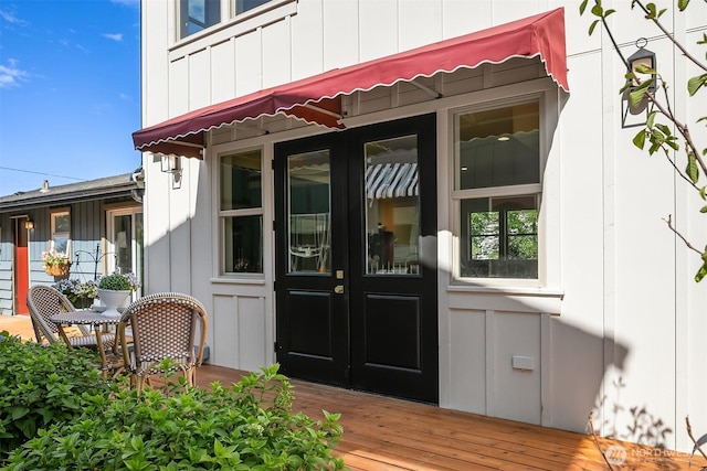 5037 25th Ave SW, Seattle, WA 98106 - property entrance featuring french doors and board and batten siding