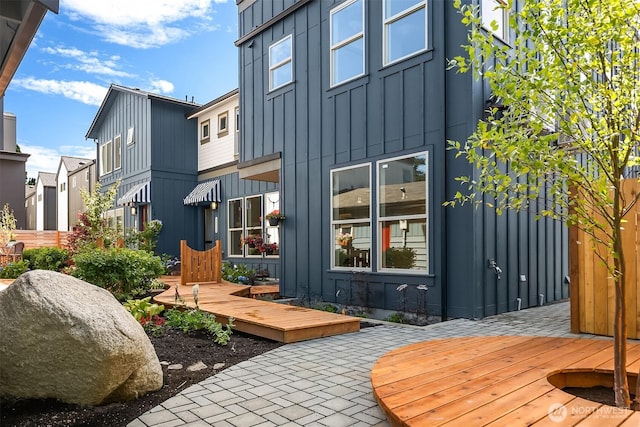 5037 25th Ave SW, Seattle, WA 98106 - rear view of property featuring board and batten siding and a wooden deck