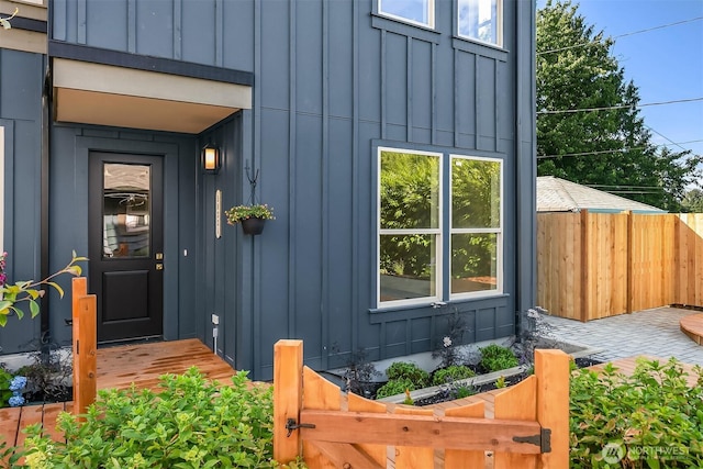 5037 25th Ave SW, Seattle, WA 98106 - entrance to property with board and batten siding and a gate