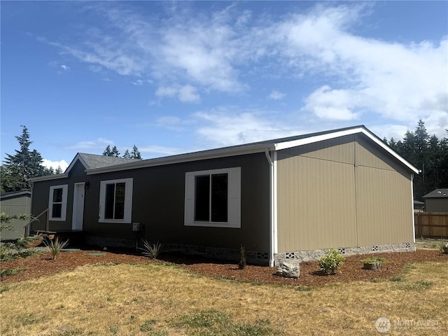 303 Critter Country Trl, Sequim, WA 98382 - view of side of home with crawl space and a lawn
