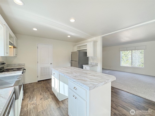 303 Critter Country Trl, Sequim, WA 98382 - kitchen featuring freestanding refrigerator, stainless steel electric range, under cabinet range hood, a kitchen island, and white cabinetry