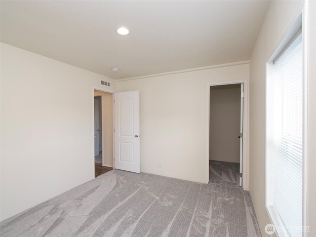 303 Critter Country Trl, Sequim, WA 98382 - unfurnished bedroom with carpet flooring, a spacious closet, and recessed lighting