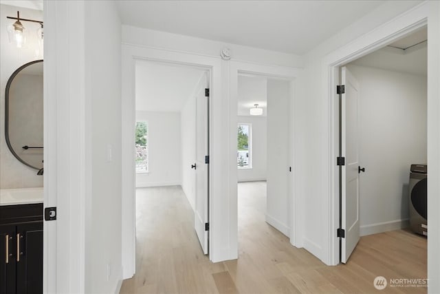 150 Cliff Robinson Ln, Sequim, WA 98382 - hall featuring light wood-type flooring and washer / clothes dryer