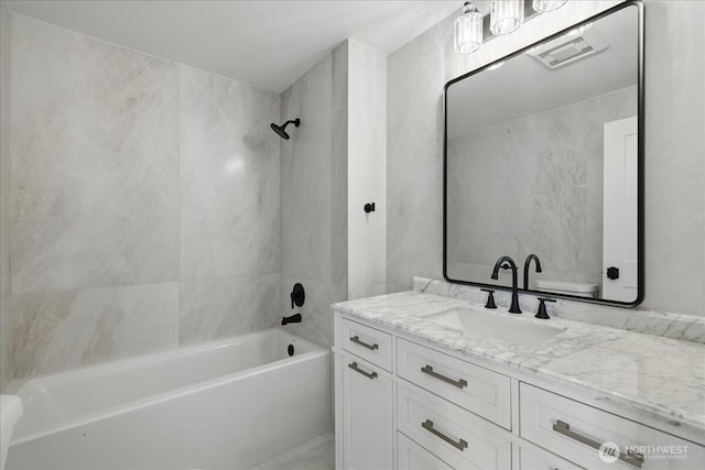 150 Cliff Robinson Ln, Sequim, WA 98382 - full bath featuring vanity, bathing tub / shower combination, and marble look tiles