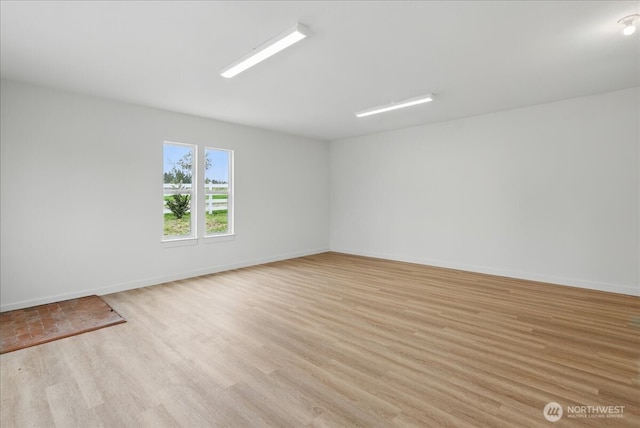150 Cliff Robinson Ln, Sequim, WA 98382 - spare room with light wood-style floors and baseboards