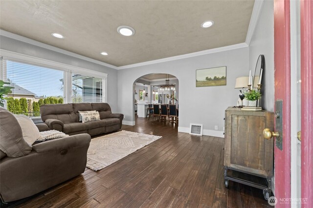 256 & St, Buckley, WA 98321 - living area with arched walkways, dark wood finished floors, crown molding, and recessed lighting