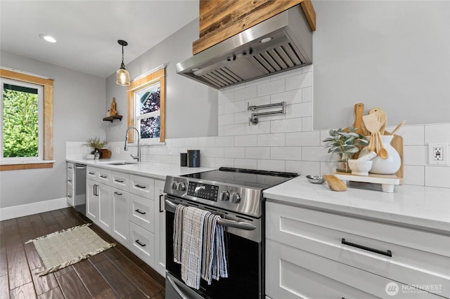 256 & St, Buckley, WA 98321 - kitchen featuring stainless steel appliances, wall chimney exhaust hood, white cabinets, decorative backsplash, and recessed lighting