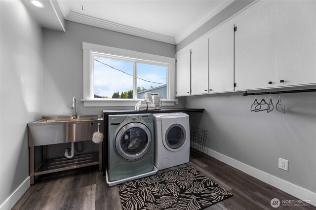 256 & St, Buckley, WA 98321 - laundry room with washing machine and clothes dryer, cabinet space, crown molding, and dark wood-style floors