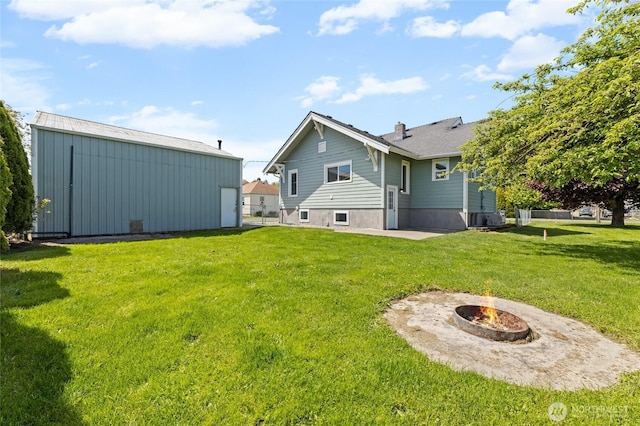 256 & St, Buckley, WA 98321 - back of house with a lawn, an outdoor fire pit, a patio, an outdoor structure, and an outbuilding
