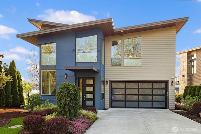 3003 Mountain View Ave N, Renton, WA 98056 - modern home featuring concrete driveway and an attached garage