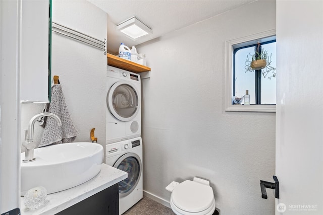 2401 N Northlake Way Unit F6, Seattle, WA 98103 - bathroom featuring stacked washer / drying machine and vanity
