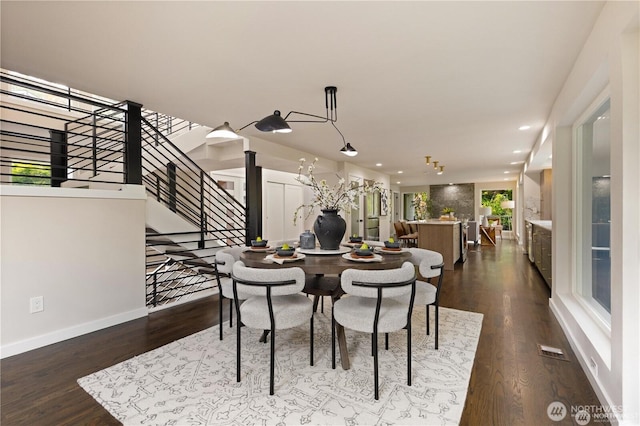 18510 NE 15th Pl, Bellevue, WA 98008 - dining area featuring stairs, dark wood-style flooring, and recessed lighting