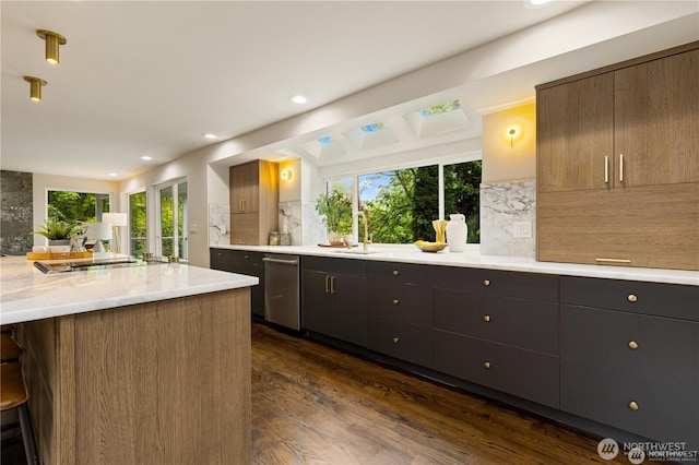 18510 NE 15th Pl, Bellevue, WA 98008 - kitchen featuring stainless steel dishwasher, decorative backsplash, dark wood finished floors, healthy amount of natural light, and recessed lighting