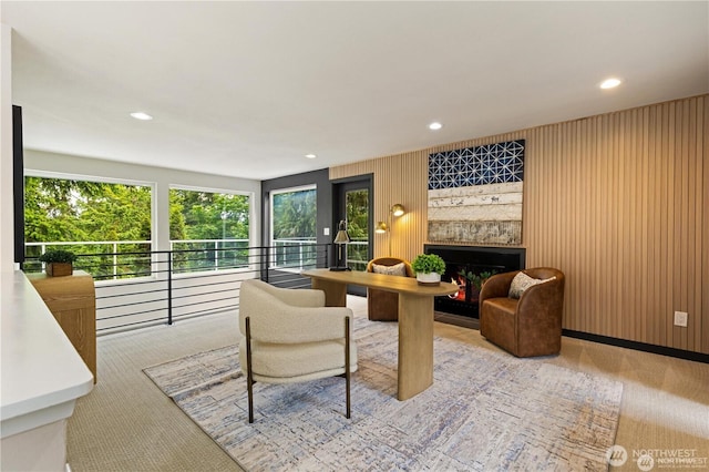 18510 NE 15th Pl, Bellevue, WA 98008 - carpeted living room with a fireplace, recessed lighting, and wood walls