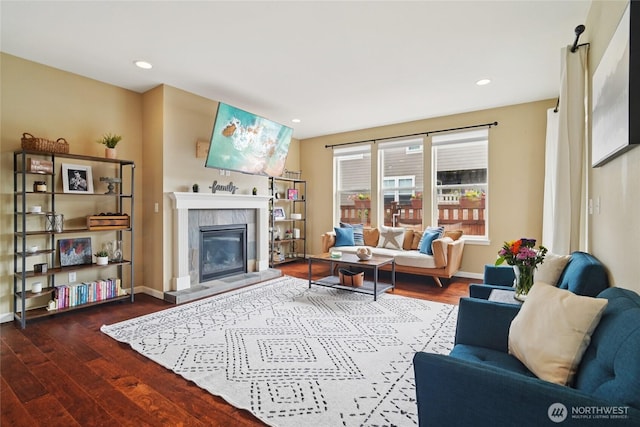13712 Big Sky Dr E, Bonney Lake, WA 98391 - living area featuring wood finished floors, a tiled fireplace, and recessed lighting