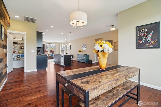 13712 Big Sky Dr E, Bonney Lake, WA 98391 - dining area with dark wood-type flooring, recessed lighting, and a chandelier
