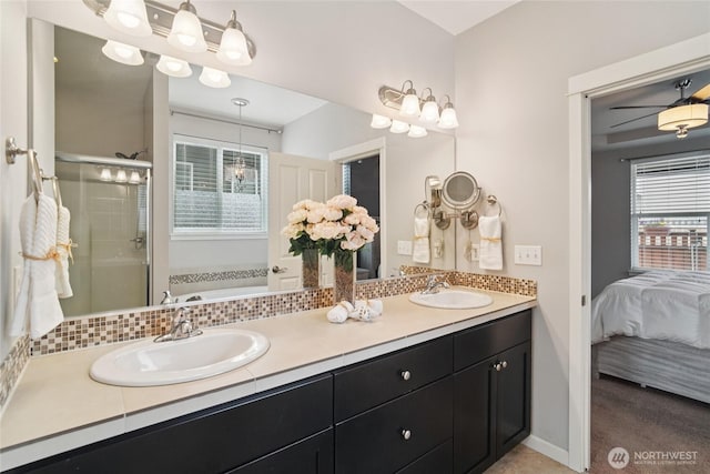 13712 Big Sky Dr E, Bonney Lake, WA 98391 - bathroom with double vanity, plenty of natural light, a shower stall, and a garden tub