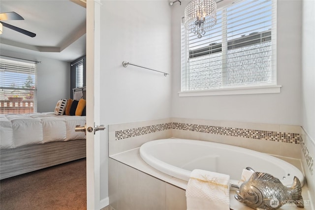 13712 Big Sky Dr E, Bonney Lake, WA 98391 - full bath featuring connected bathroom, a bath, a ceiling fan, and a chandelier
