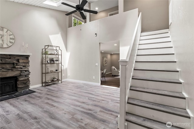 1535 Ten Mile Rd, Everson, WA 98247 - unfurnished living room featuring ceiling fan, stairway, a towering ceiling, wood finished floors, and recessed lighting