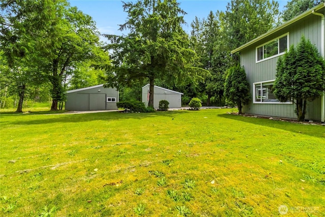 1535 Ten Mile Rd, Everson, WA 98247 - view of green lawn featuring a pole building, an outbuilding, and a garage