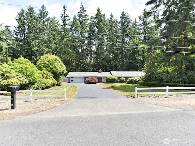 7819 25th Ave E, Tacoma, WA 98404 - ranch-style home featuring asphalt driveway and a garage