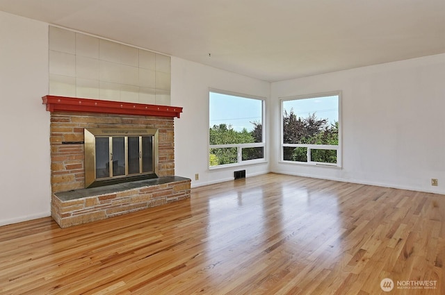 5312 S Hazel St, Seattle, WA 98178 - unfurnished living room with wood finished floors and a glass covered fireplace