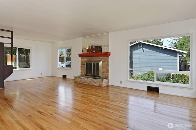 5312 S Hazel St, Seattle, WA 98178 - unfurnished living room featuring wood finished floors and a fireplace