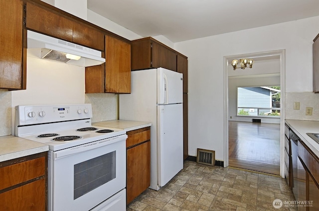 5312 S Hazel St, Seattle, WA 98178 - kitchen featuring white appliances, under cabinet range hood, and light countertops
