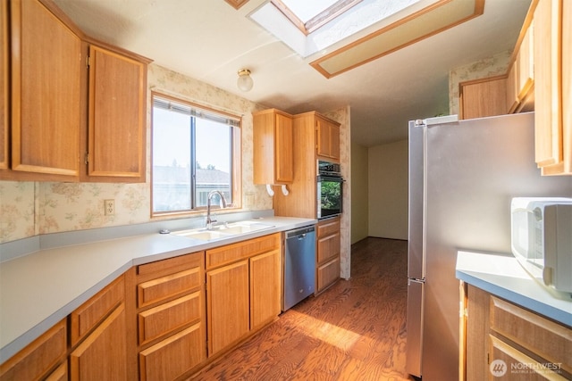 37301 28th Ave S Unit 4, Federal Way, WA 98003 - kitchen featuring dishwasher, light wood-style floors, a skylight, oven, and white microwave