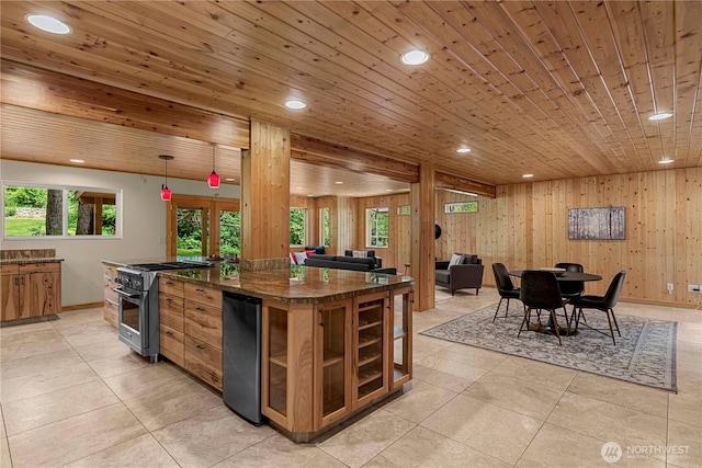 359 Timber Ridge Canyon Rd, Leavenworth, WA 98826 - kitchen featuring high end stainless steel range, dark countertops, recessed lighting, open floor plan, and light tile patterned floors