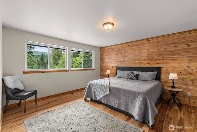 359 Timber Ridge Canyon Rd, Leavenworth, WA 98826 - bedroom featuring wooden walls and wood finished floors
