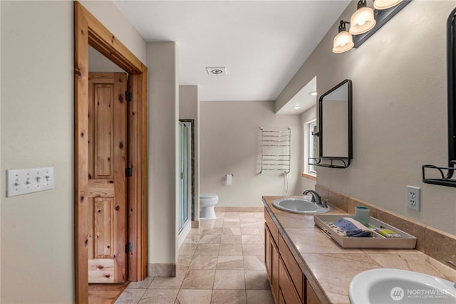 359 Timber Ridge Canyon Rd, Leavenworth, WA 98826 - bathroom with double vanity, a shower stall, and recessed lighting