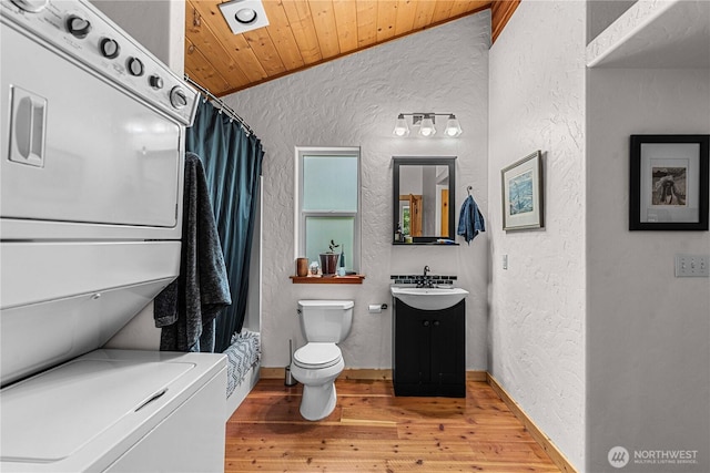 359 Timber Ridge Canyon Rd, Leavenworth, WA 98826 - full bath featuring a textured wall, stacked washer / drying machine, vanity, wooden ceiling, and wood finished floors