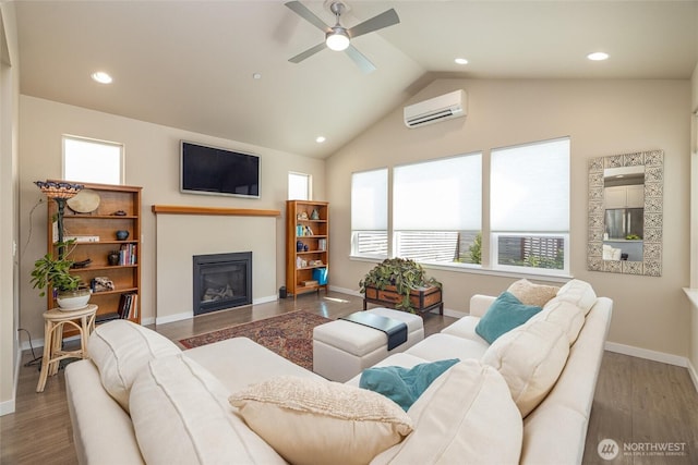 707 Northview St, Bellingham, WA 98226 - living area featuring a wall unit AC, healthy amount of natural light, ceiling fan, a glass covered fireplace, and recessed lighting