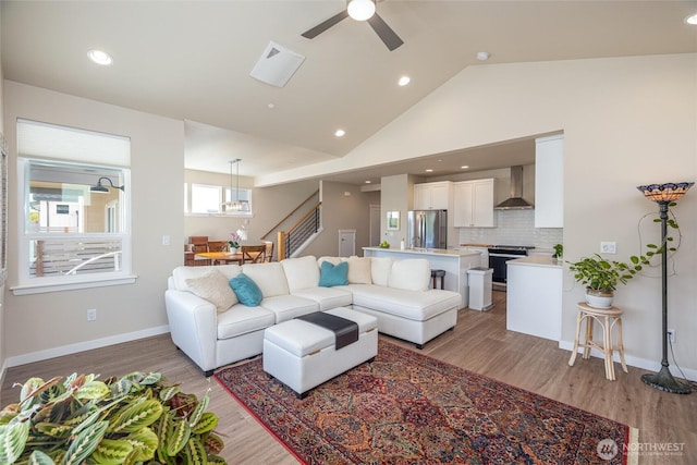 707 Northview St, Bellingham, WA 98226 - living room featuring a ceiling fan, stairs, light wood-type flooring, recessed lighting, and high vaulted ceiling