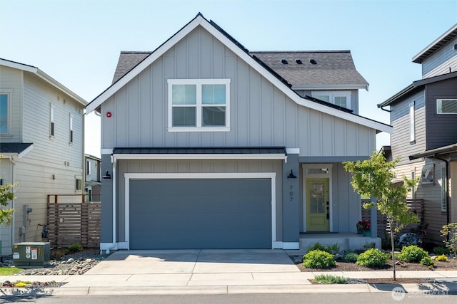 707 Northview St, Bellingham, WA 98226 - view of front of home featuring board and batten siding, a shingled roof, concrete driveway, and a garage