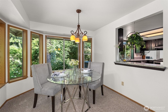 2735 Fordham Ct SE, Lacey, WA 98503 - carpeted dining room featuring a chandelier and baseboards